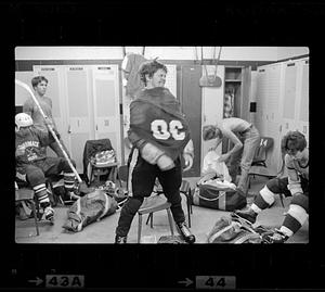 Youth hockey players in locker room, Woburn