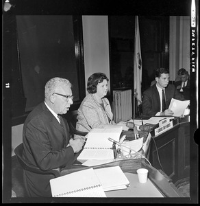 Boston School Supt. William H. Ohrenberger reads his report as Committeewoman Louise Day Hicks sits in thought
