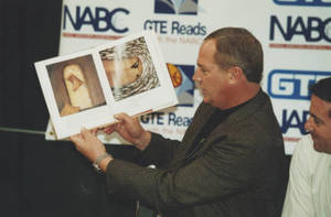 Coach Charlie Brock reading a children's book