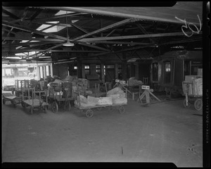 US Mail carts at train track depot
