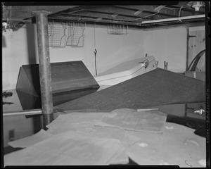 Household items floating in flooded basement